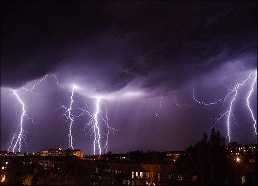 141300266 Lightning storm over city in purple light, available in multiple sizes