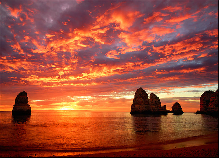 60734390 Sunrise over the ocean with red clouds islands and cliffs over the water, available in multiple sizes